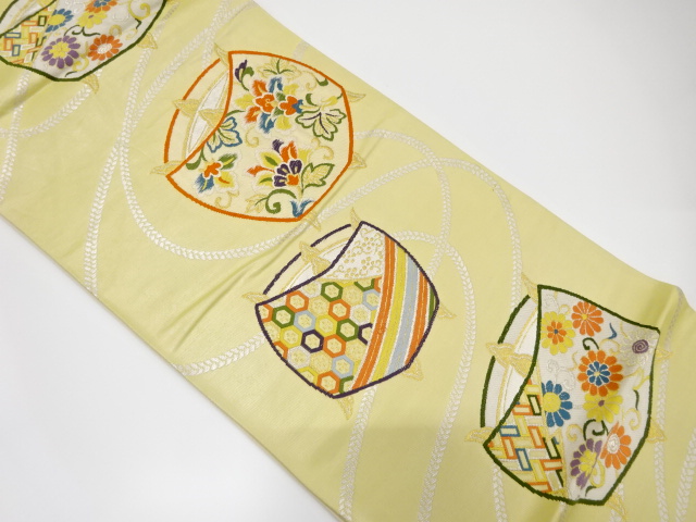 糸巻きに花唐草模様織り出し袋帯